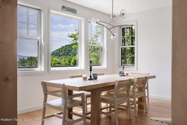 a white bath tub sitting in a bathroom next to a window