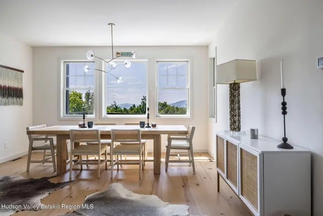 a white bath tub sitting in a bathroom next to a window