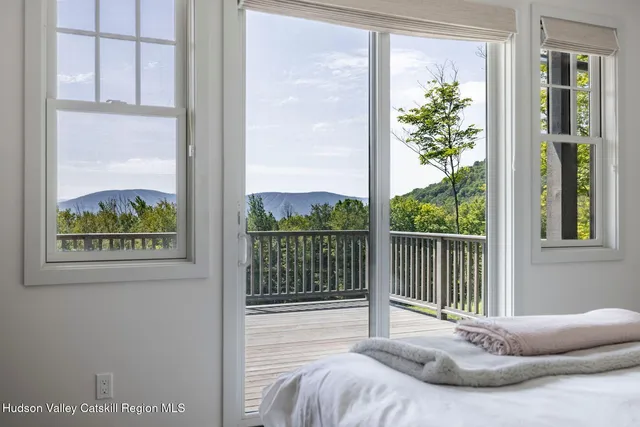 a view of a windows and ceiling fan in a balcony