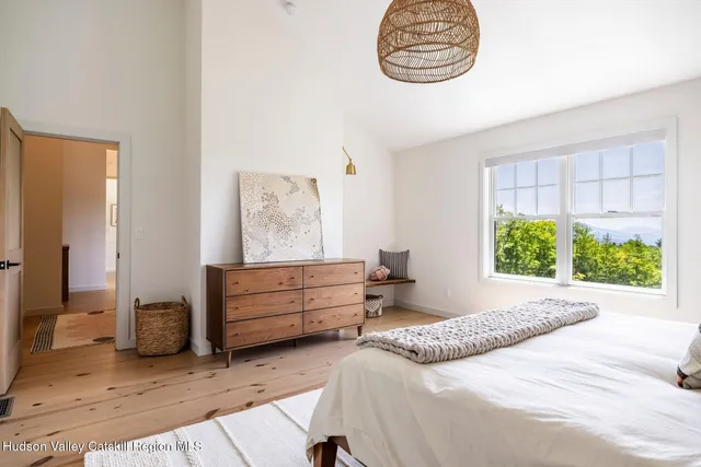 a bathroom with a toilet a sink and a mirror