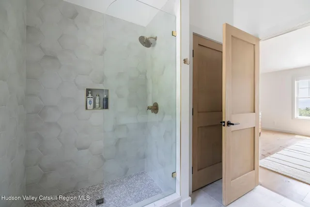 a view of room with furniture and wooden floor