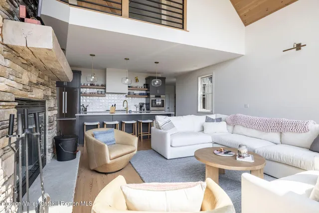 a living room with fireplace furniture and a flat screen tv