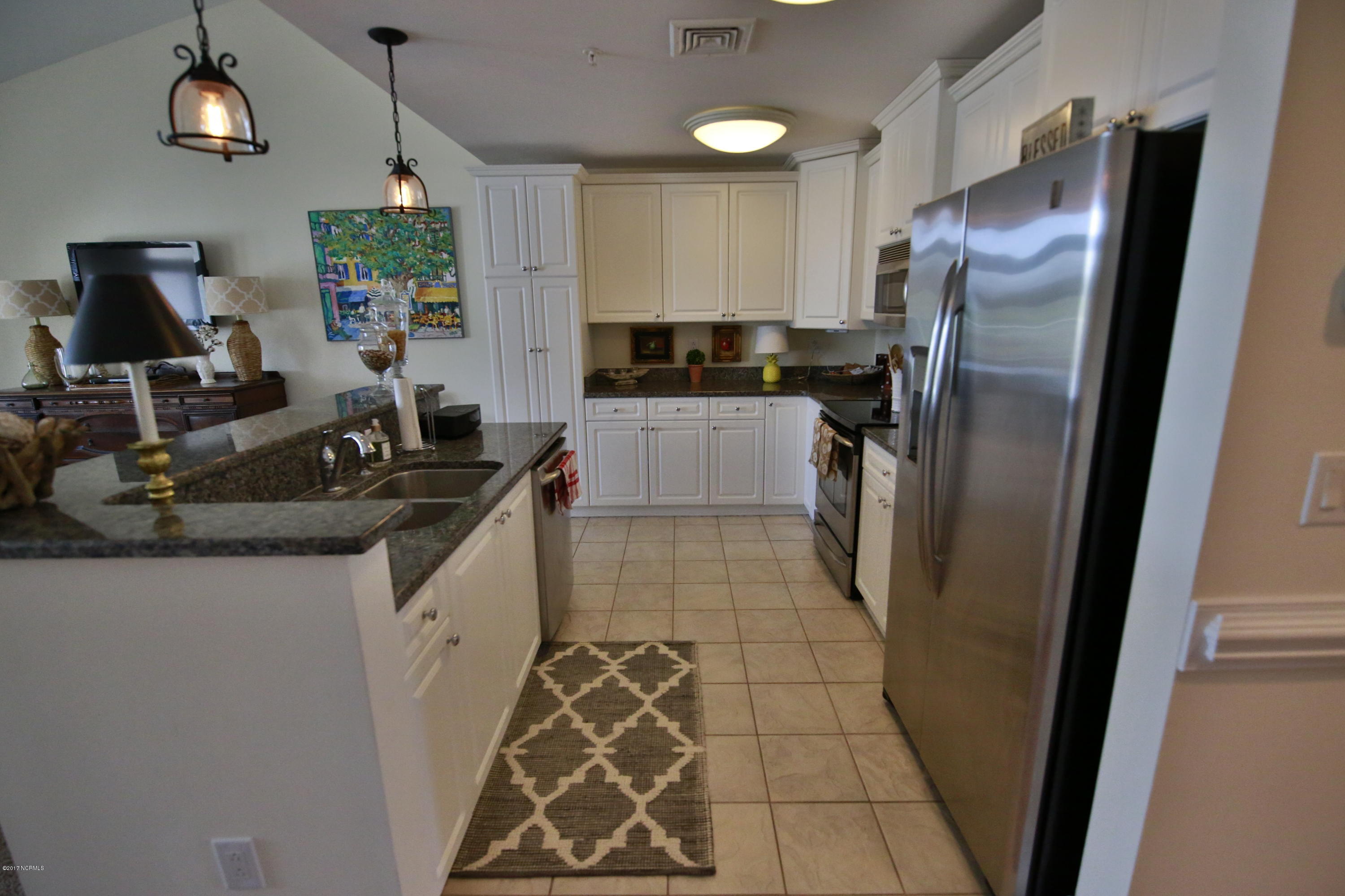 150 Lands End Road, Unit C32 Morehead City, NC 28557 - Photo 9 of 25 Gourmet Kitchen Features Granite Counter Tops And Stainless Steel Appliances