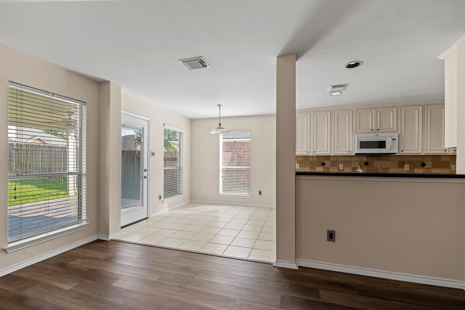 15311 Redbud Berry Way Cypress, TX 77433 - Photo 11 of 30 a view of kitchen with granite countertop cabinets and window