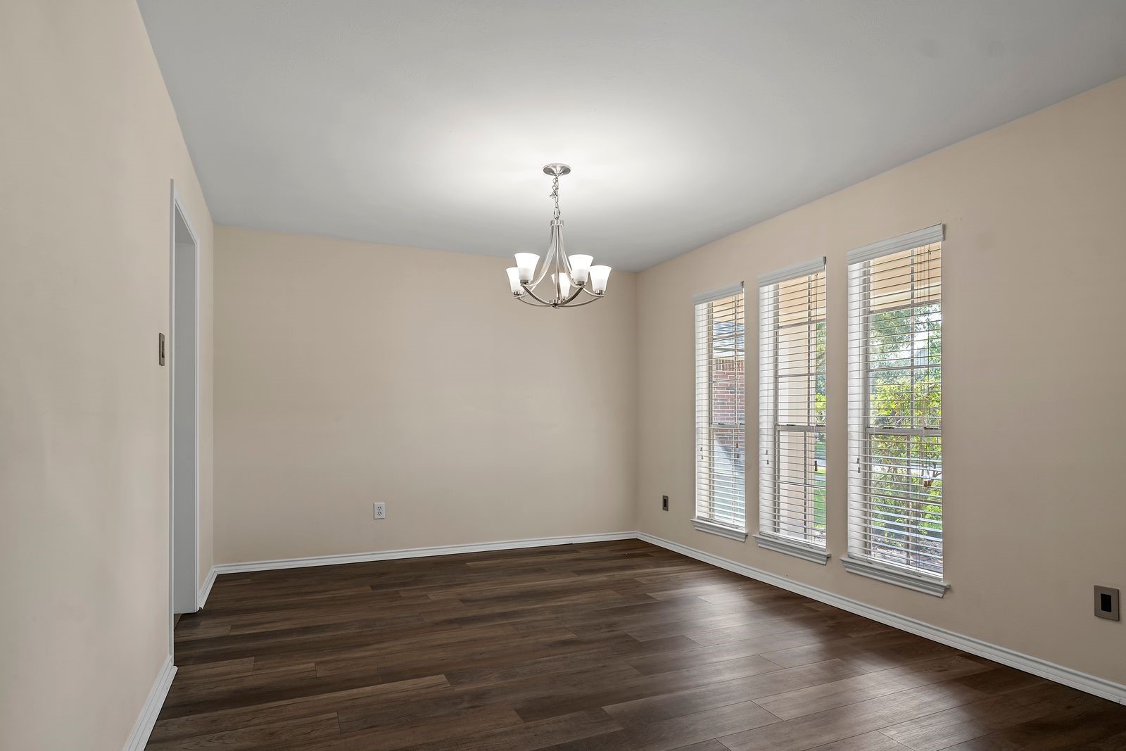 15311 Redbud Berry Way Cypress, TX 77433 - Photo 12 of 30 wooden floor in an empty room with a window