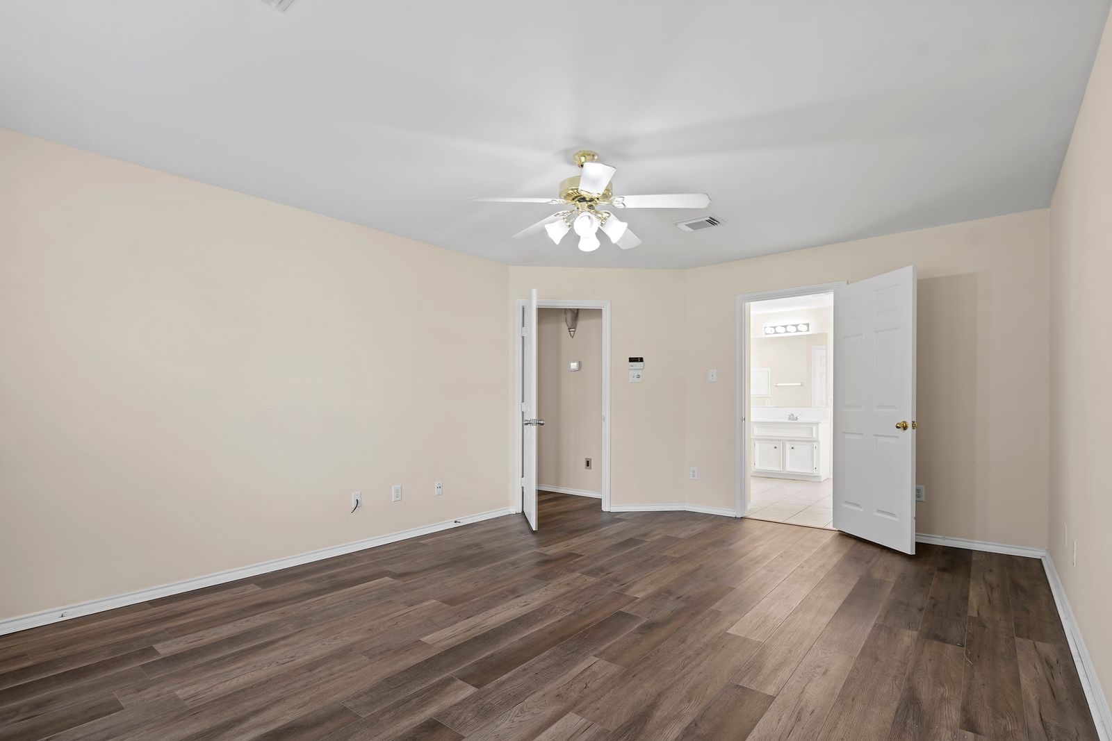 15311 Redbud Berry Way Cypress, TX 77433 - Photo 14 of 30 a view of an empty room with wooden floor