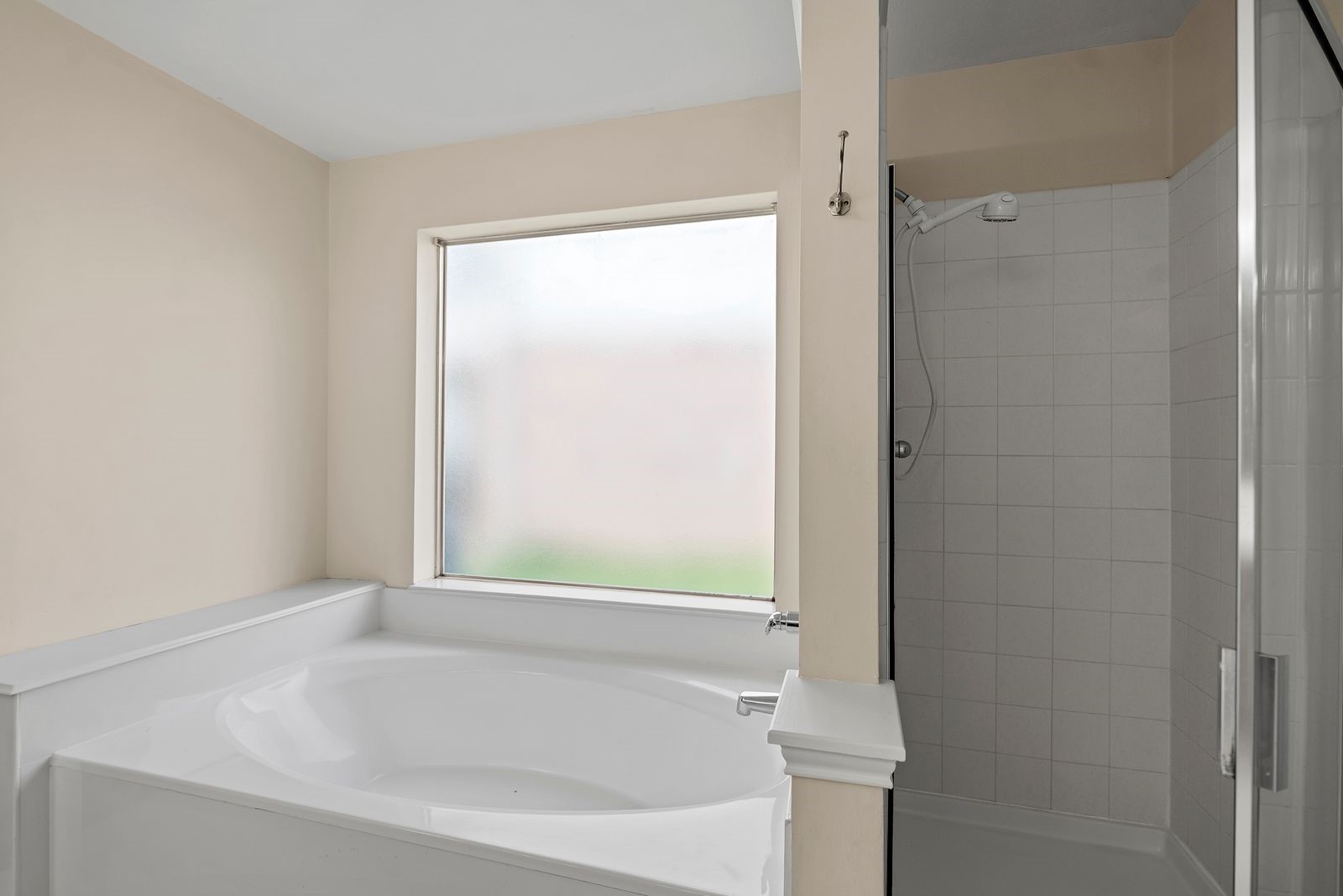 15311 Redbud Berry Way Cypress, TX 77433 - Photo 16 of 30 a white bath tub sitting next to a shower