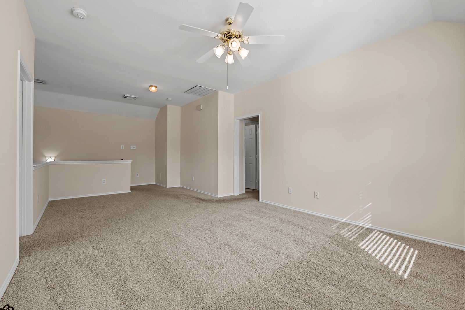 15311 Redbud Berry Way Cypress, TX 77433 - Photo 20 of 30 a view of a room with a ceiling fan and a fan