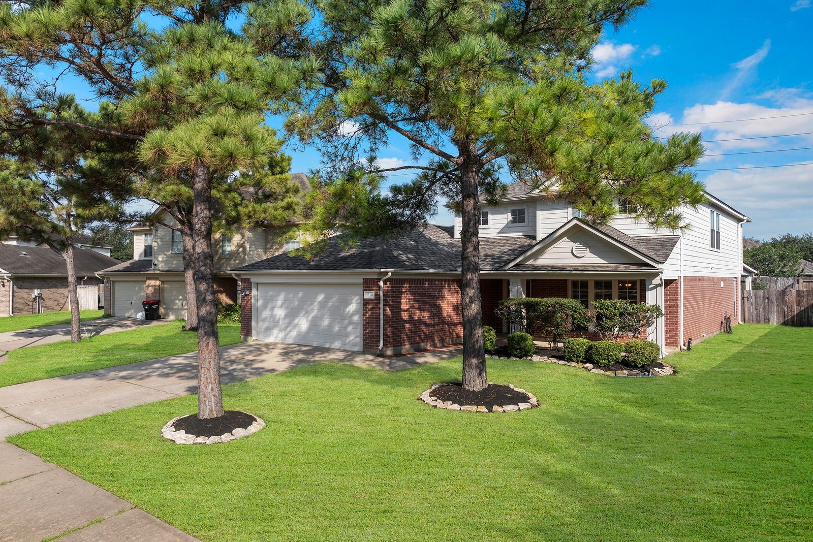 15311 Redbud Berry Way Cypress, TX 77433 - Photo 2 of 30 a front view of a house with garden