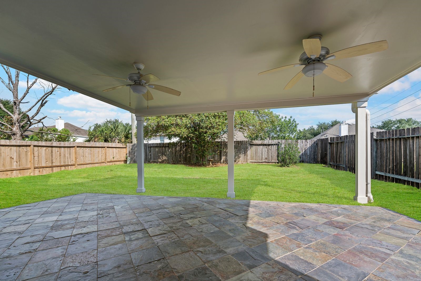 15311 Redbud Berry Way Cypress, TX 77433 - Photo 28 of 30 a view of a backyard and porch