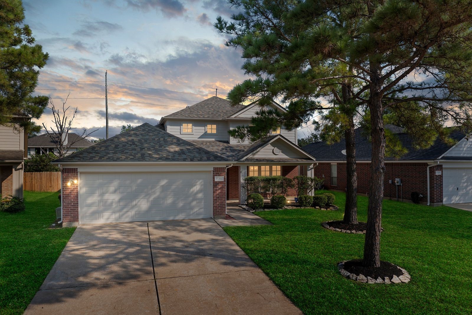 15311 Redbud Berry Way Cypress, TX 77433 - Photo 3 of 30 a front view of a house with garden