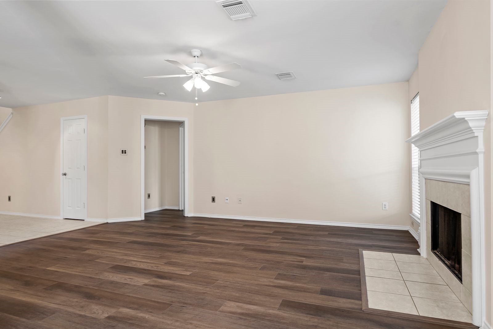 15311 Redbud Berry Way Cypress, TX 77433 - Photo 8 of 30 a view of empty room with wooden floor and fan