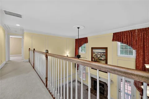 a view of a hallway with windows