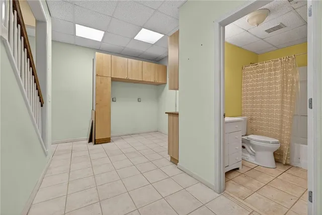 a view of a bathroom with a toilet and a shower
