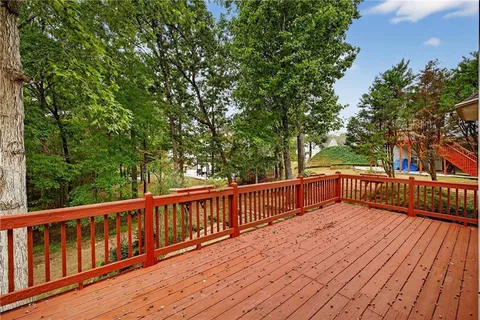 a view of deck with a trees