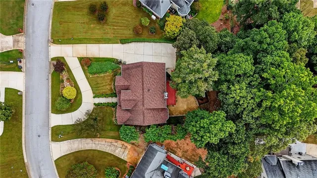 an aerial view of residential house with outdoor space and swimming pool