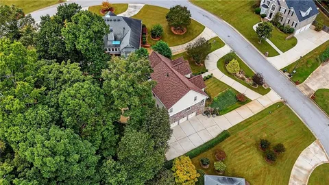 an aerial view of a house with a swimming pool