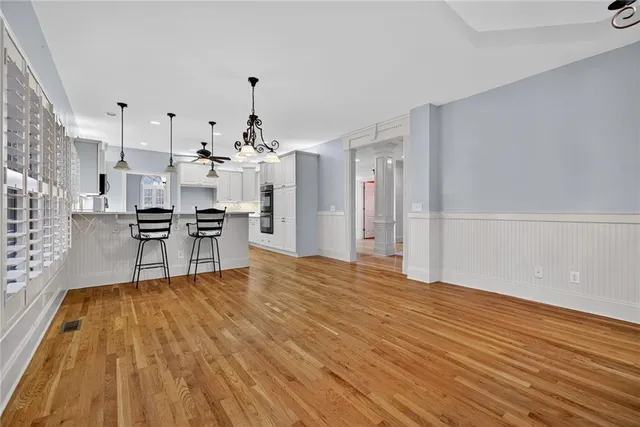 a view of kitchen with furniture and wooden floor