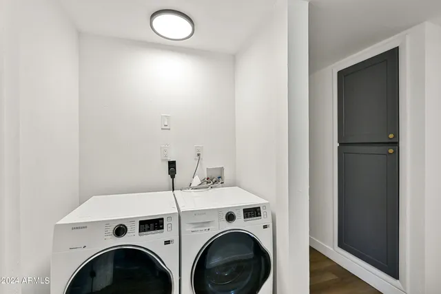 a view of livingroom with washer and dryer