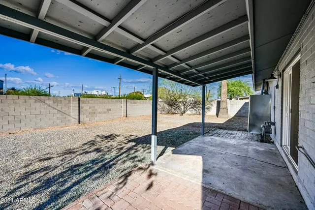 a view of a backyard of the house