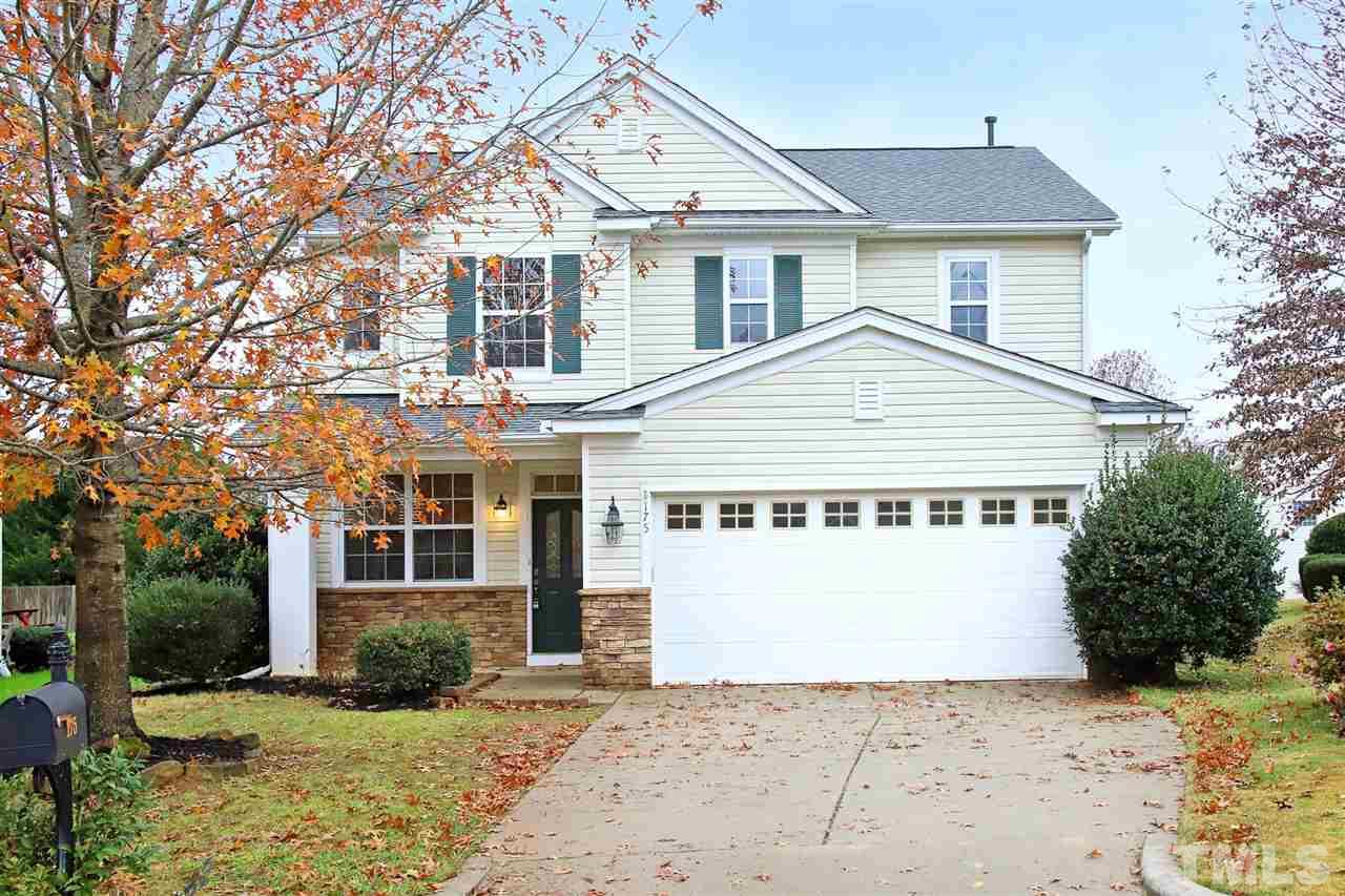 175 Solheim Lane Raleigh, NC 27603 - Photo 1 of 26 a view of a white house with a large tree in front of it