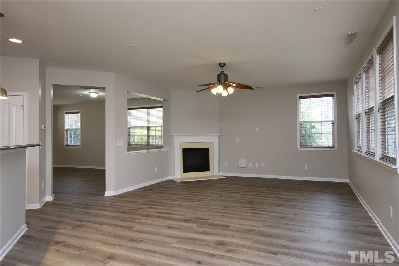175 Solheim Lane Raleigh, NC 27603 - Photo 5 of 26 wooden floor chandelier and windows in an empty room