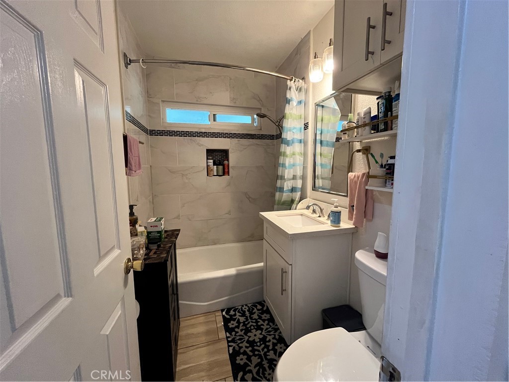 12188 Oracle Street Norwalk, CA 90650 - Photo 11 of 29 a bathroom with a sink toilet and shower