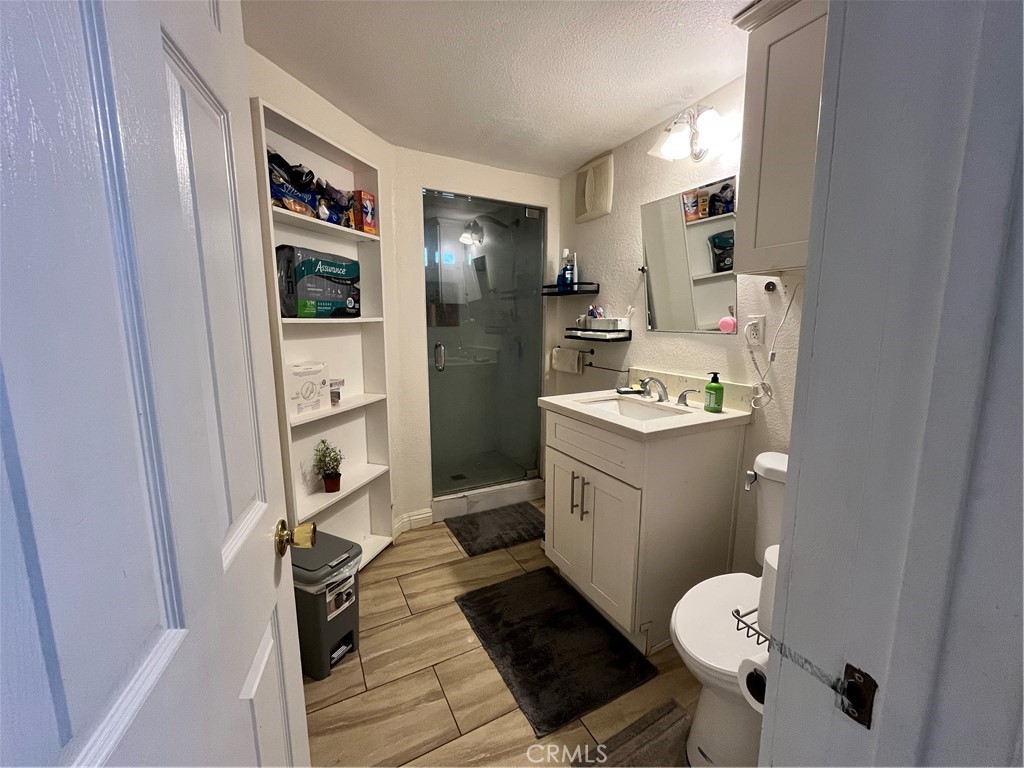 12188 Oracle Street Norwalk, CA 90650 - Photo 15 of 29 a bathroom with a sink toilet and shower