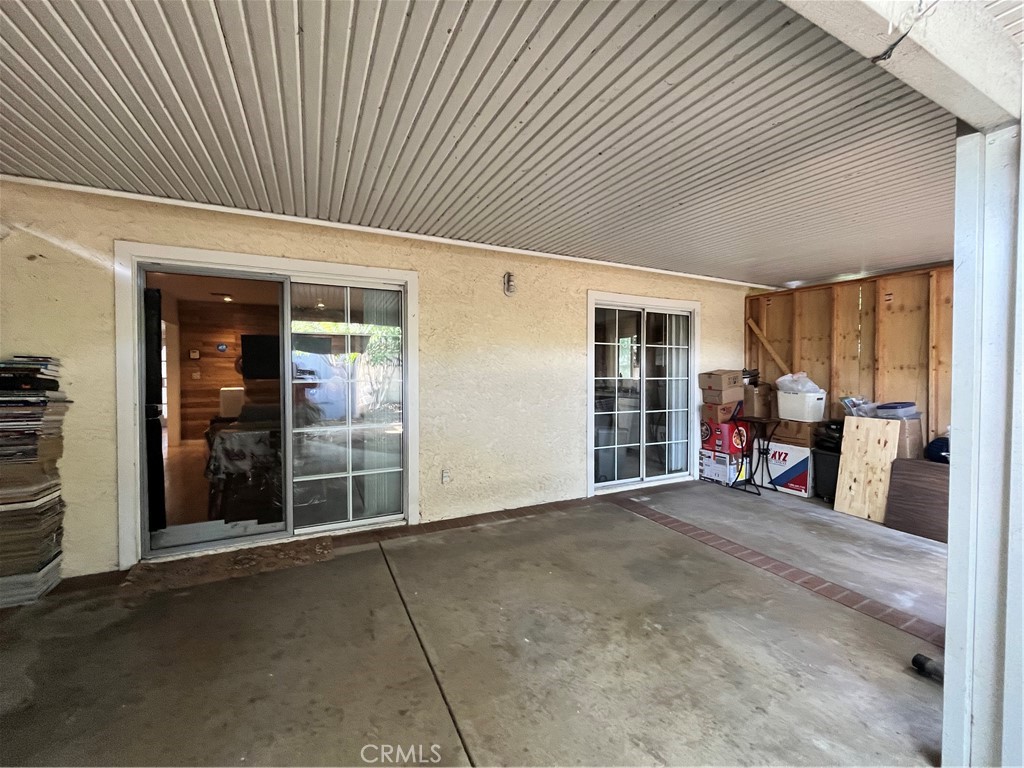 12188 Oracle Street Norwalk, CA 90650 - Photo 16 of 29 an entryway of a livingroom with furniture and floor to ceiling window
