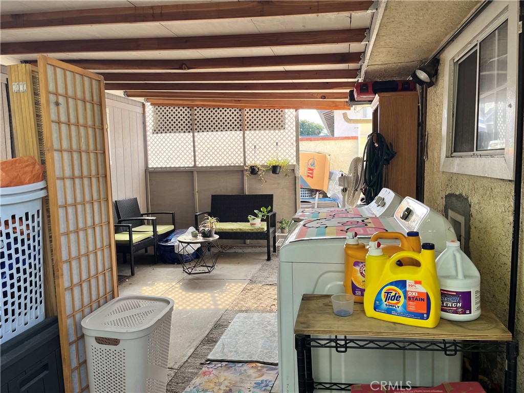 12188 Oracle Street Norwalk, CA 90650 - Photo 17 of 29 a living room with a couch and a table