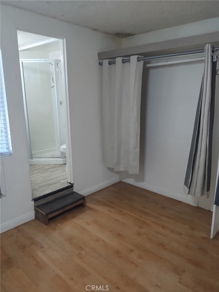 12188 Oracle Street Norwalk, CA 90650 - Photo 23 of 29 a view of a room with wooden floor and closet