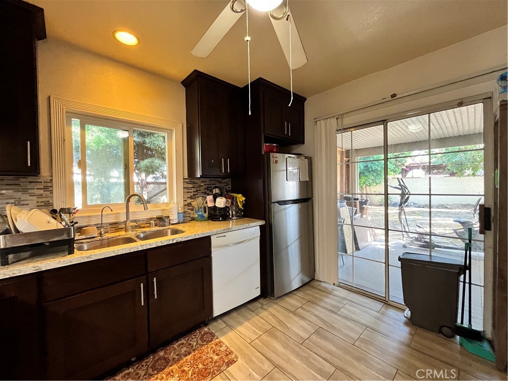12188 Oracle Street Norwalk, CA 90650 - Photo 5 of 29 a kitchen with a sink a refrigerator and window