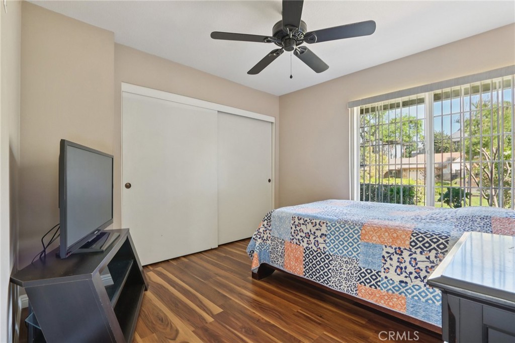 1250 Blazewood Street Riverside, CA 92507 - Photo 16 of 29 a bedroom with a bed and a flat screen tv
