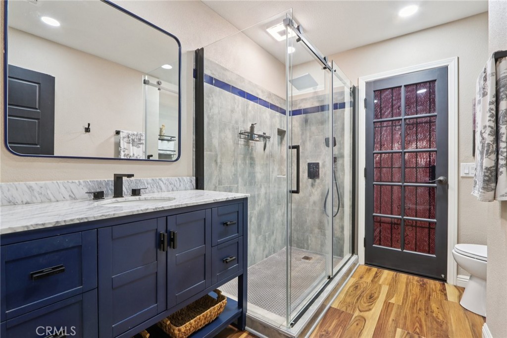 1250 Blazewood Street Riverside, CA 92507 - Photo 17 of 29 a bathroom with a sink a toilet and shower