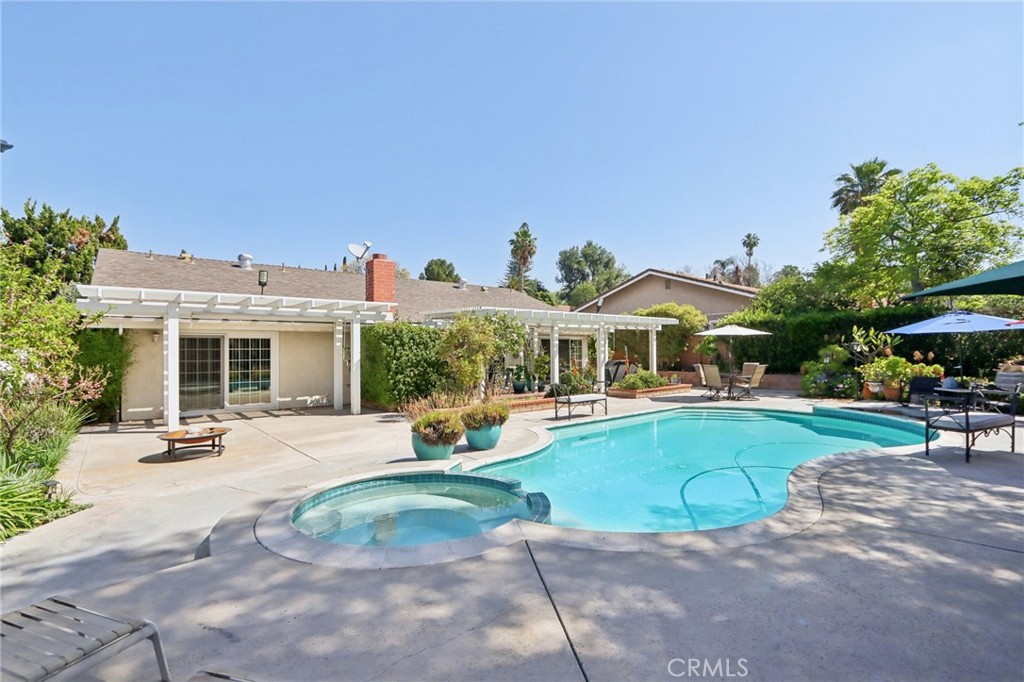 1250 Blazewood Street Riverside, CA 92507 - Photo 18 of 29 a view of a house with swimming pool and sitting area