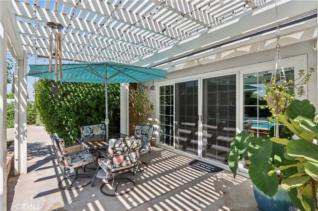 1250 Blazewood Street Riverside, CA 92507 - Photo 20 of 29 a view of a patio with table and chairs potted plants