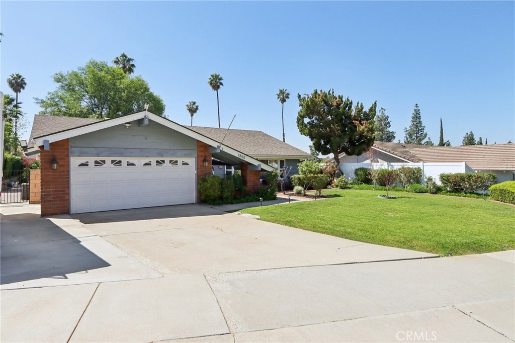 1250 Blazewood Street Riverside, CA 92507 - Photo 2 of 29 a front view of a house with garden