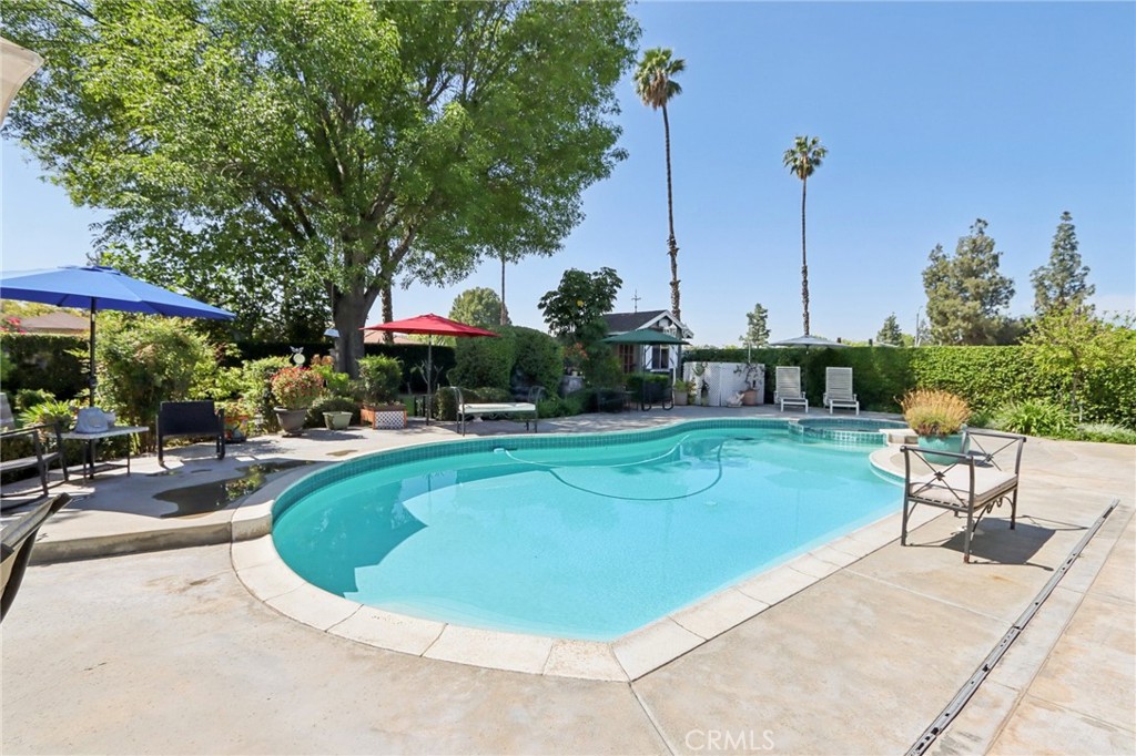 1250 Blazewood Street Riverside, CA 92507 - Photo 26 of 29 a view of a swimming pool with sitting area