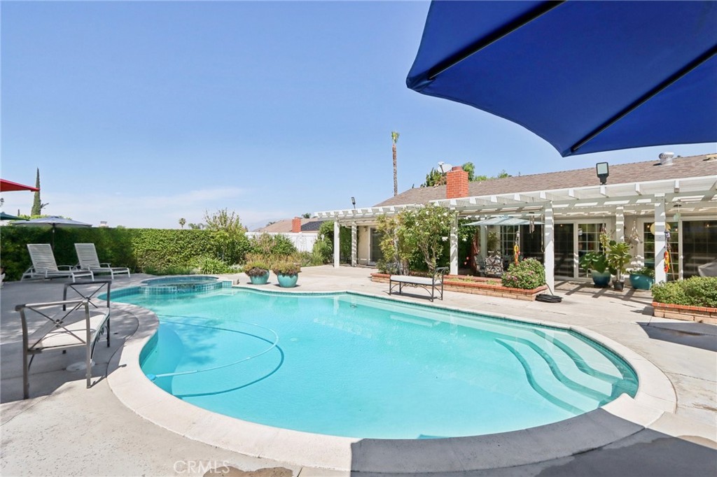1250 Blazewood Street Riverside, CA 92507 - Photo 27 of 29 a view of a swimming pool with chairs