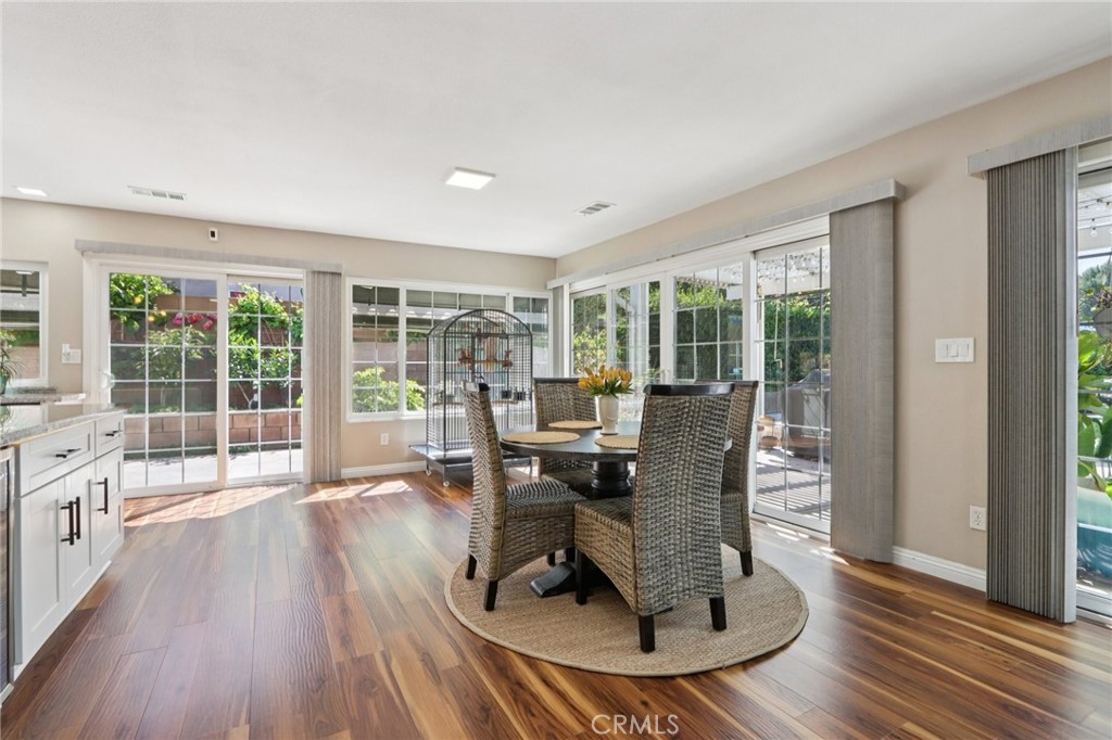 1250 Blazewood Street Riverside, CA 92507 - Photo 7 of 29 a living room with furniture floor to ceiling window and wooden floor
