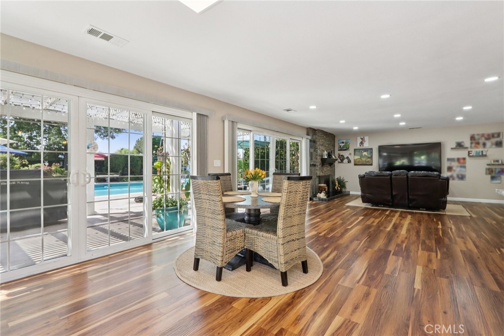 1250 Blazewood Street Riverside, CA 92507 - Photo 8 of 29 a living room with furniture a large window and wooden floor