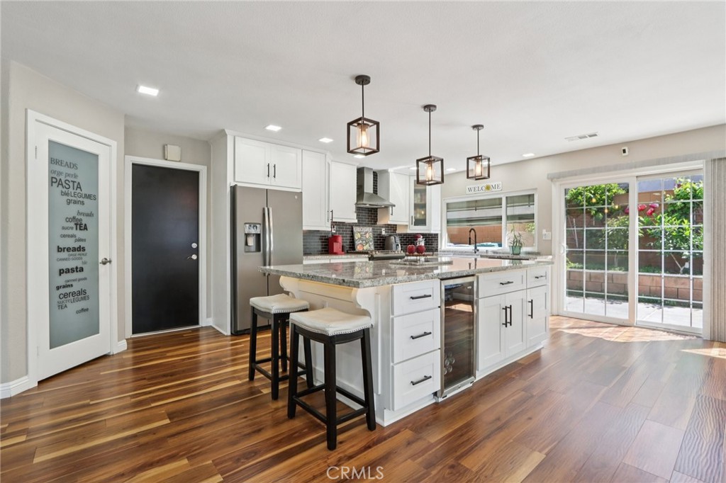 1250 Blazewood Street Riverside, CA 92507 - Photo 9 of 29 a kitchen with stainless steel appliances granite countertop a white cabinets and stove top oven