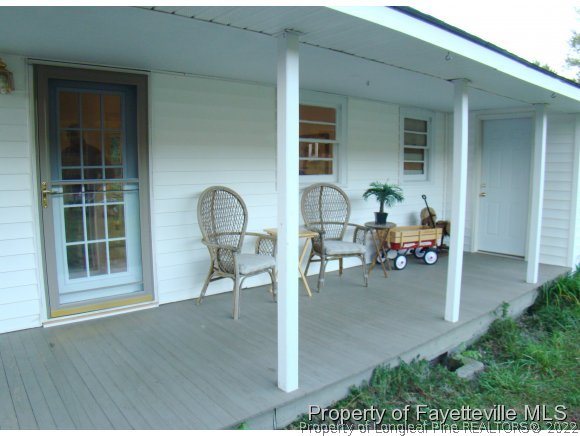 541 Heritage Farm Road Carthage, NC 28327 - Photo 19 of 25 a outdoor view with a sitting space and glass windows