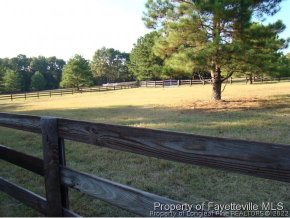 541 Heritage Farm Road Carthage, NC 28327 - Photo 6 of 25 a view of swimming pool with an outdoor space and seating area