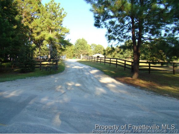 541 Heritage Farm Road Carthage, NC 28327 - Photo 8 of 25 a view of a street with an trees