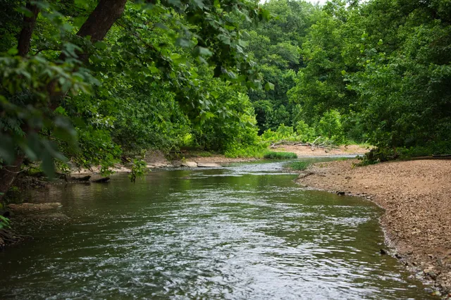 a living room with fireplace furniture and a flat screen tv