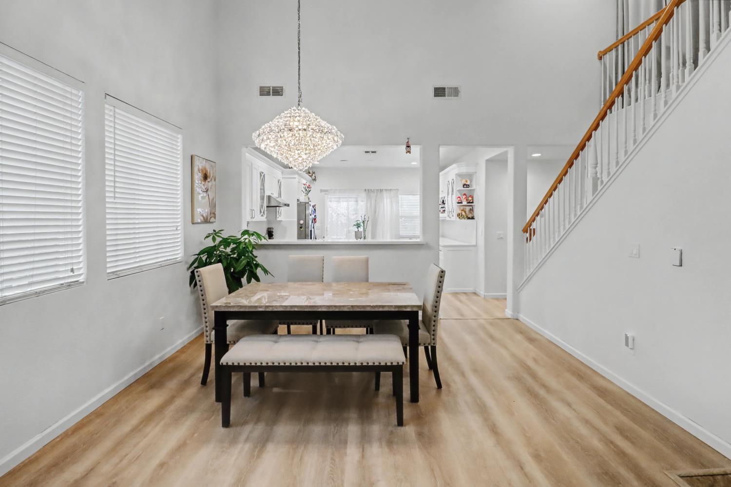 10056 Wexted Way Elk Grove, CA 95757 - Photo 12 of 39 a view of a dining room with furniture and wooden floor