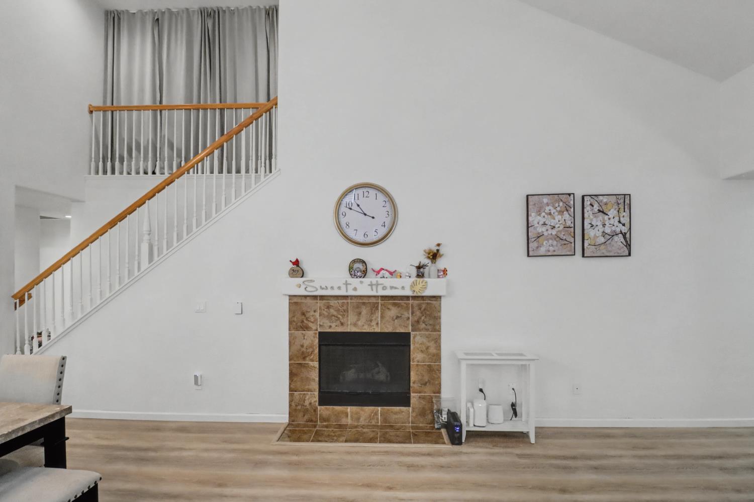 10056 Wexted Way Elk Grove, CA 95757 - Photo 13 of 39 a living room with a fireplace and a ceiling fan