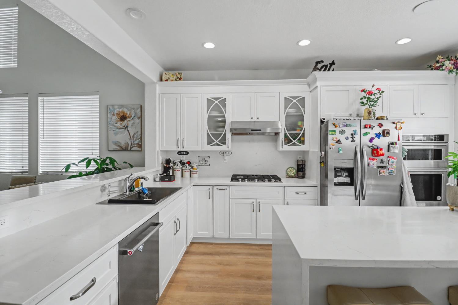 10056 Wexted Way Elk Grove, CA 95757 - Photo 17 of 39 a kitchen with appliances a sink and cabinets