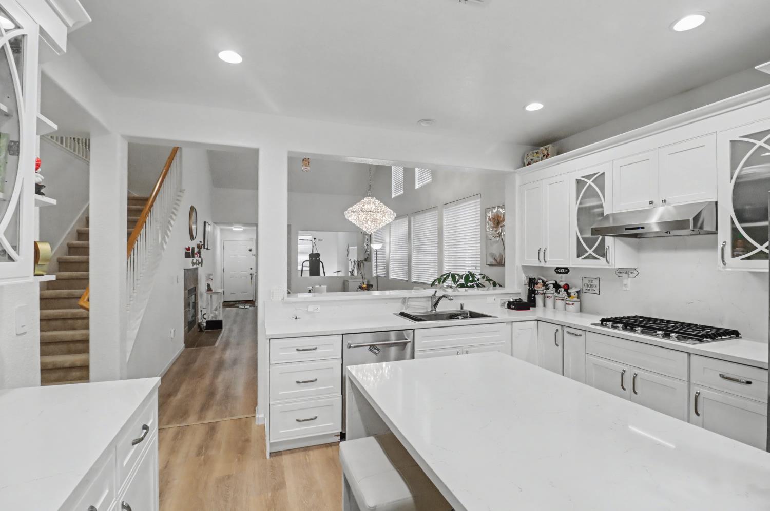 10056 Wexted Way Elk Grove, CA 95757 - Photo 24 of 39 a kitchen with white cabinets and appliances